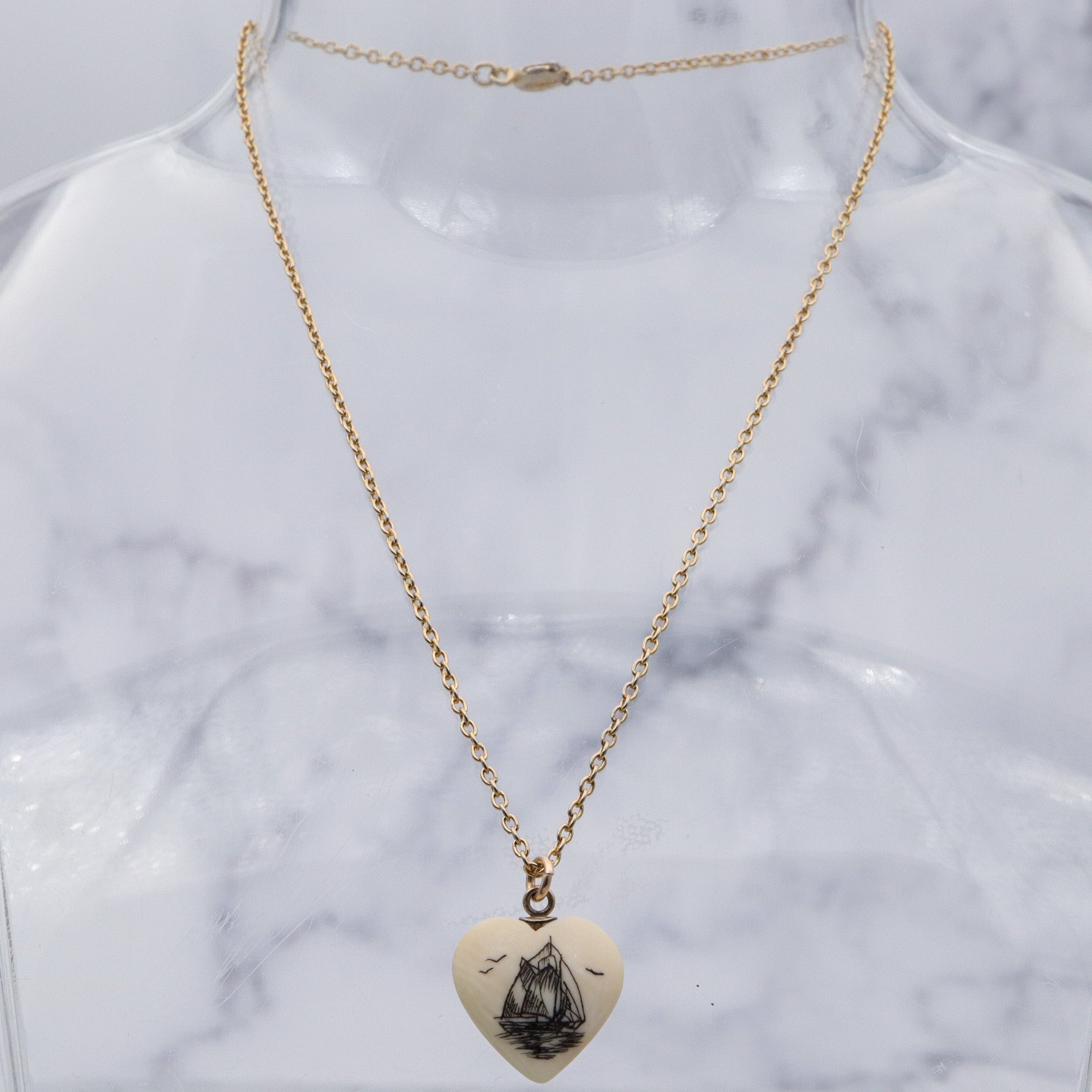 Antique hand carved faux ivory sailboat heart charm pendant